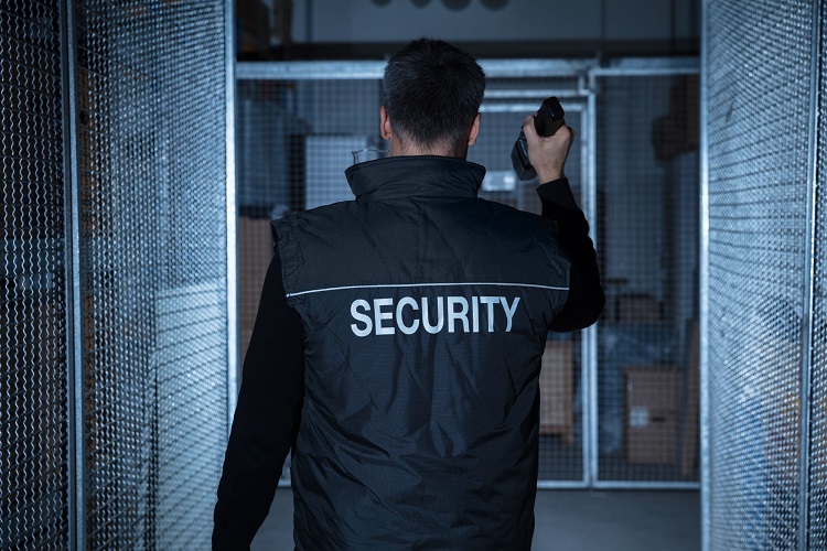 Security Guard Standing In The Warehouse